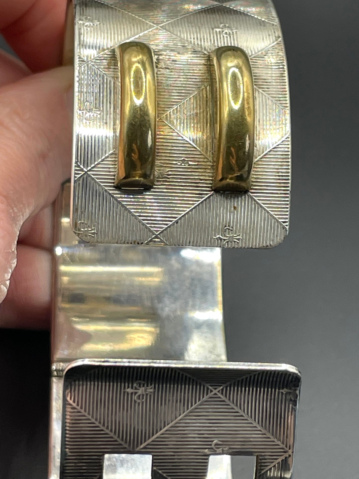 Vintage signed Kigu Art Deco engine turned machine age gold and silver tone wide bangle bracelet hinged cuff, fleur de lys Bauhaus design