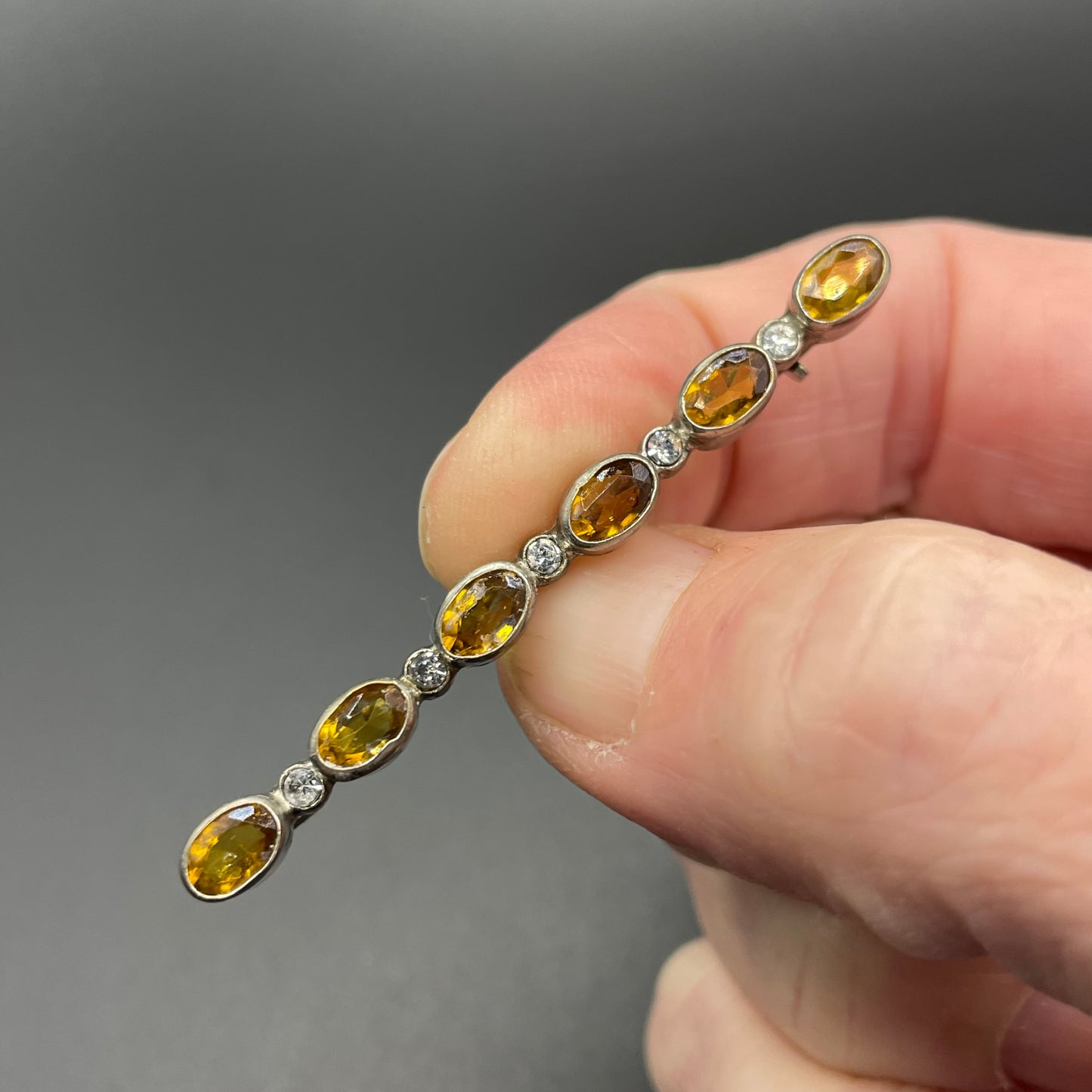Vintage collet set citrine yellow and clear glass rhinestone shiny silver tone bar brooch pin
