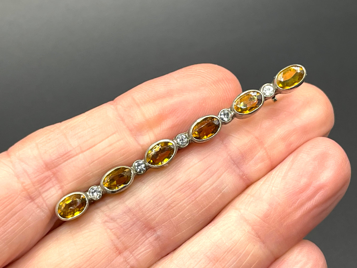 Vintage collet set citrine yellow and clear glass rhinestone shiny silver tone bar brooch pin