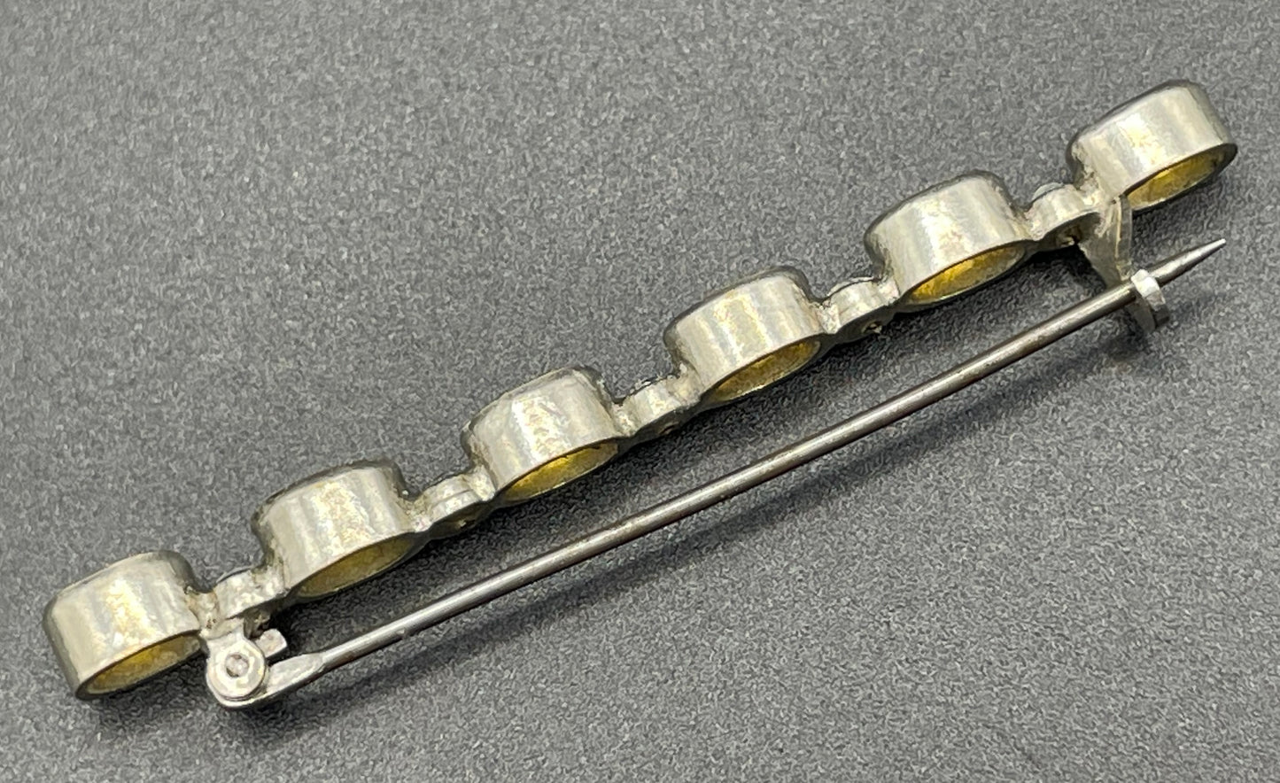Vintage collet set citrine yellow and clear glass rhinestone shiny silver tone bar brooch pin