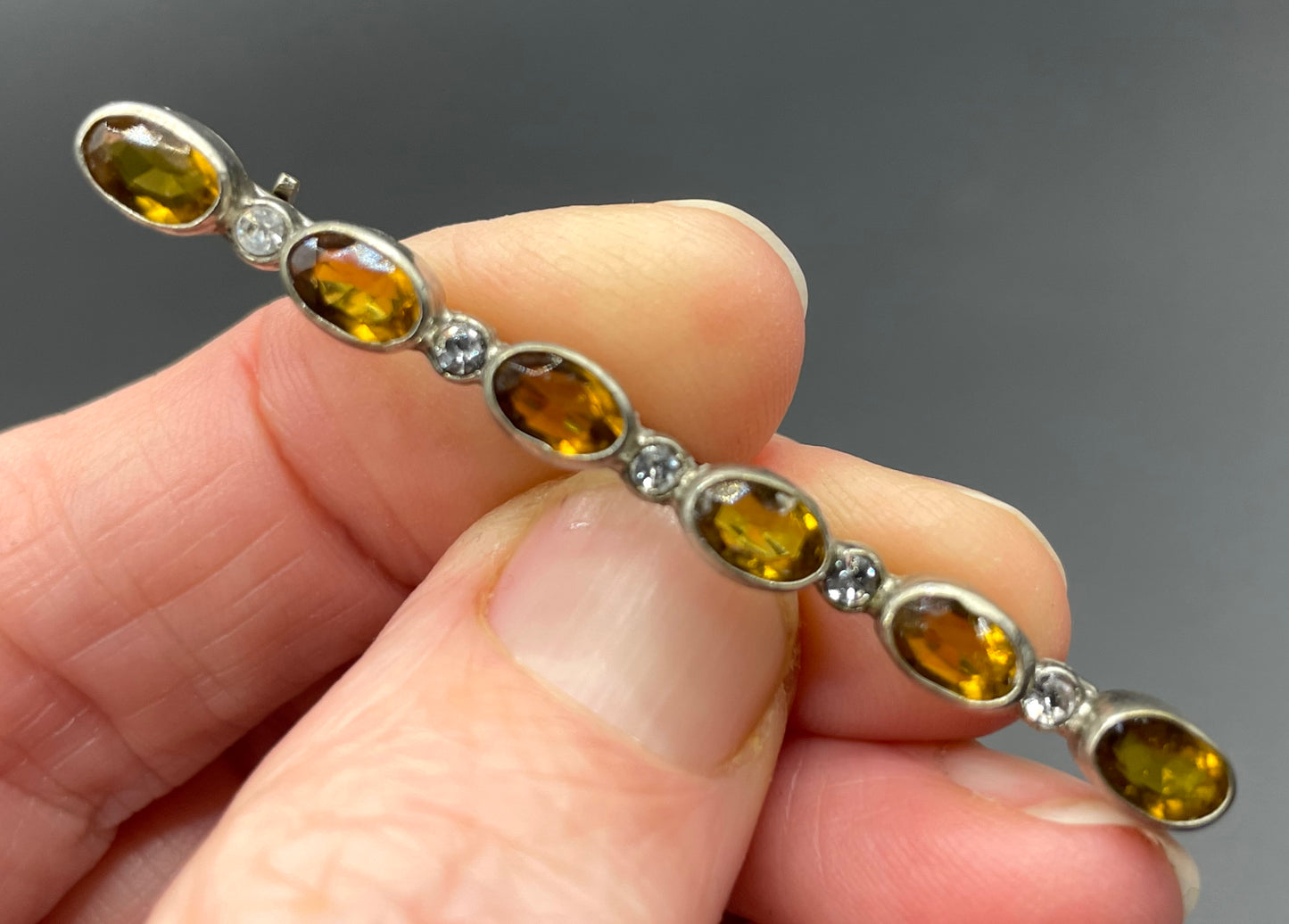 Vintage collet set citrine yellow and clear glass rhinestone shiny silver tone bar brooch pin