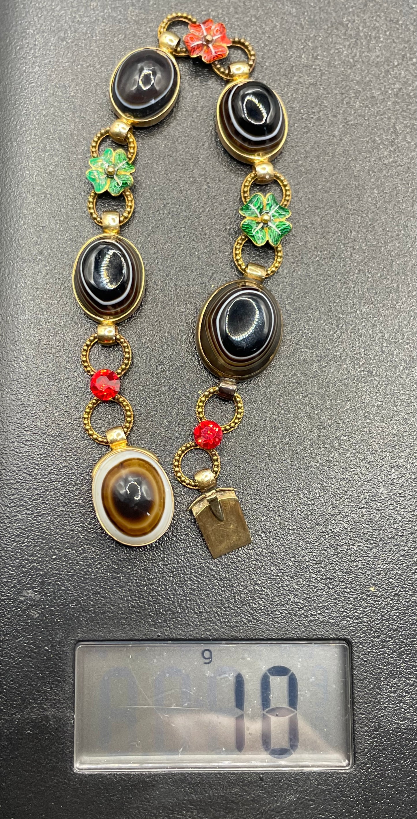 Antique Victorian unmarked 9ct gold bullseye banded agate onyx large oval cabochon, red and green enamel work flowers and red rhinestone bracelet