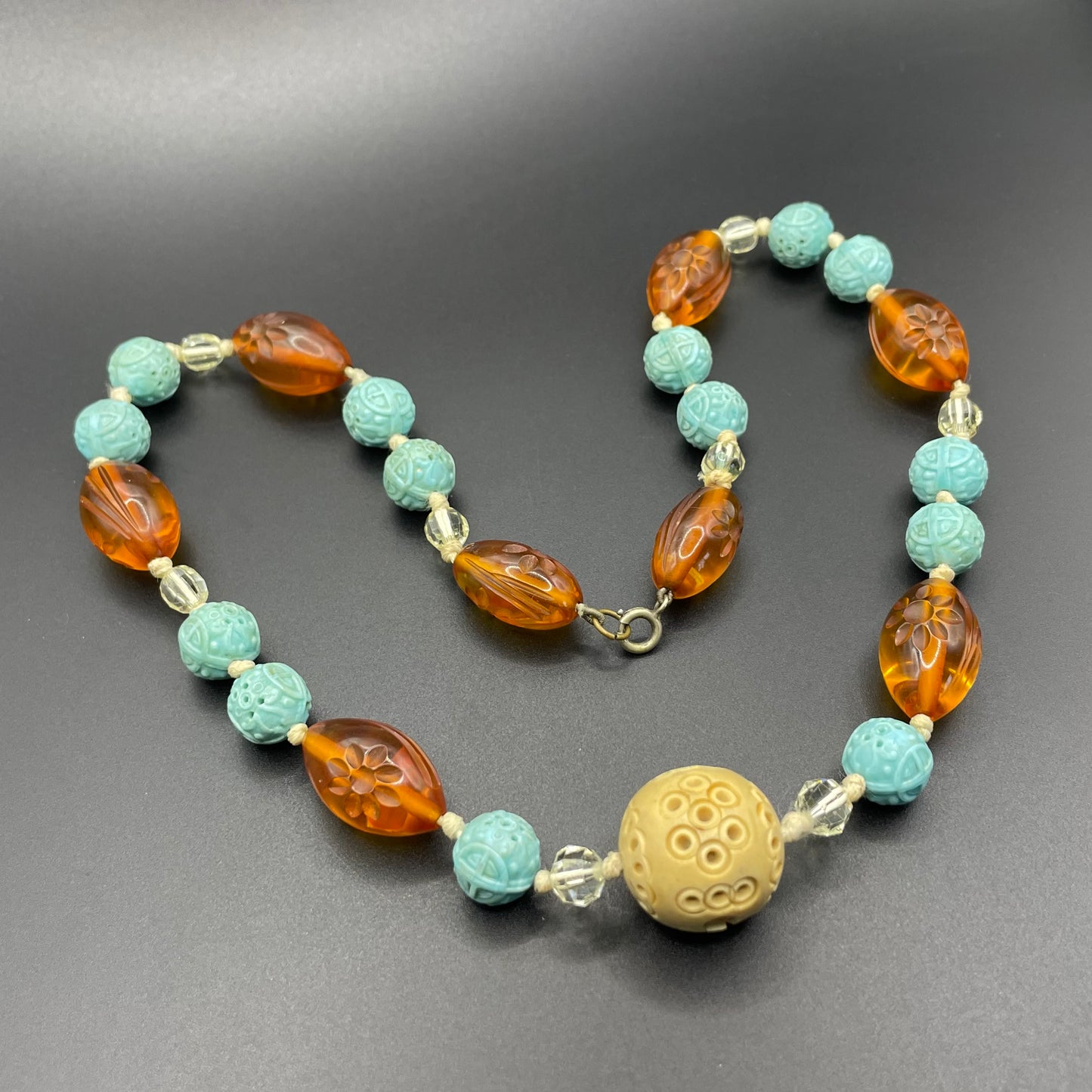 Vintage Art Deco moulded glass and carved cream galalith large bead necklace, pale blue, clear and citrine yellow / orange glass