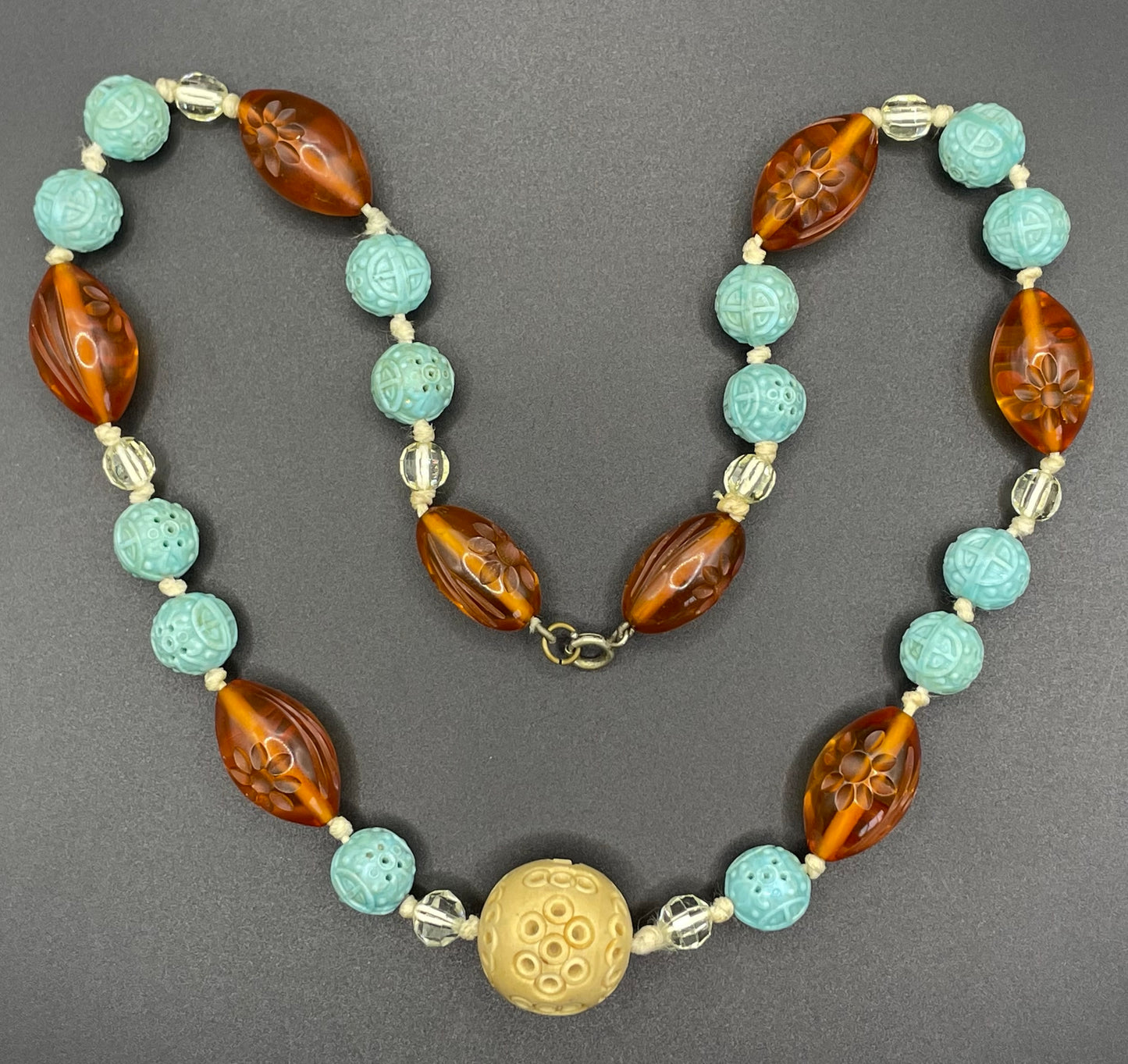 Vintage Art Deco moulded glass and carved cream galalith large bead necklace, pale blue, clear and citrine yellow / orange glass