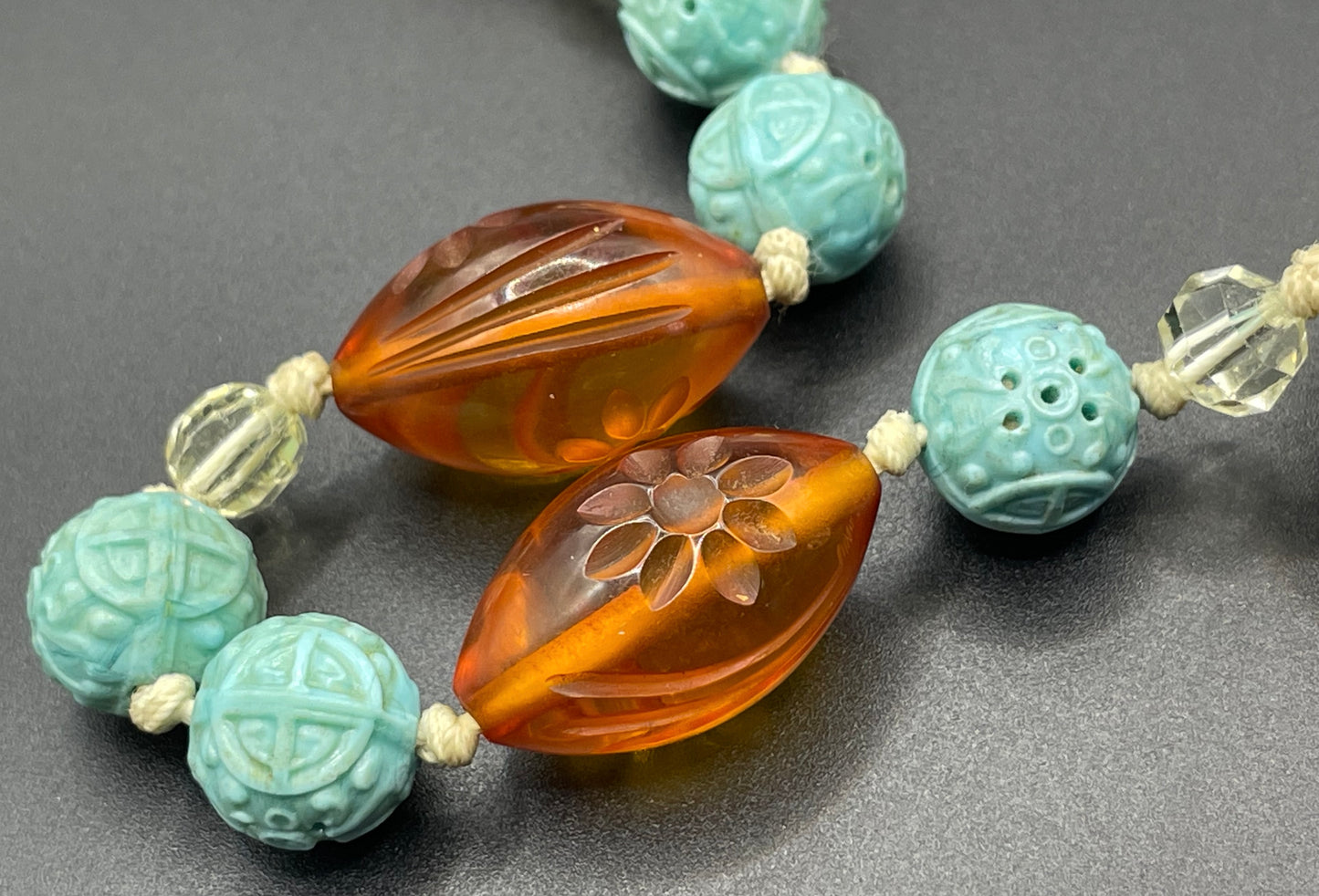 Vintage Art Deco moulded glass and carved cream galalith large bead necklace, pale blue, clear and citrine yellow / orange glass