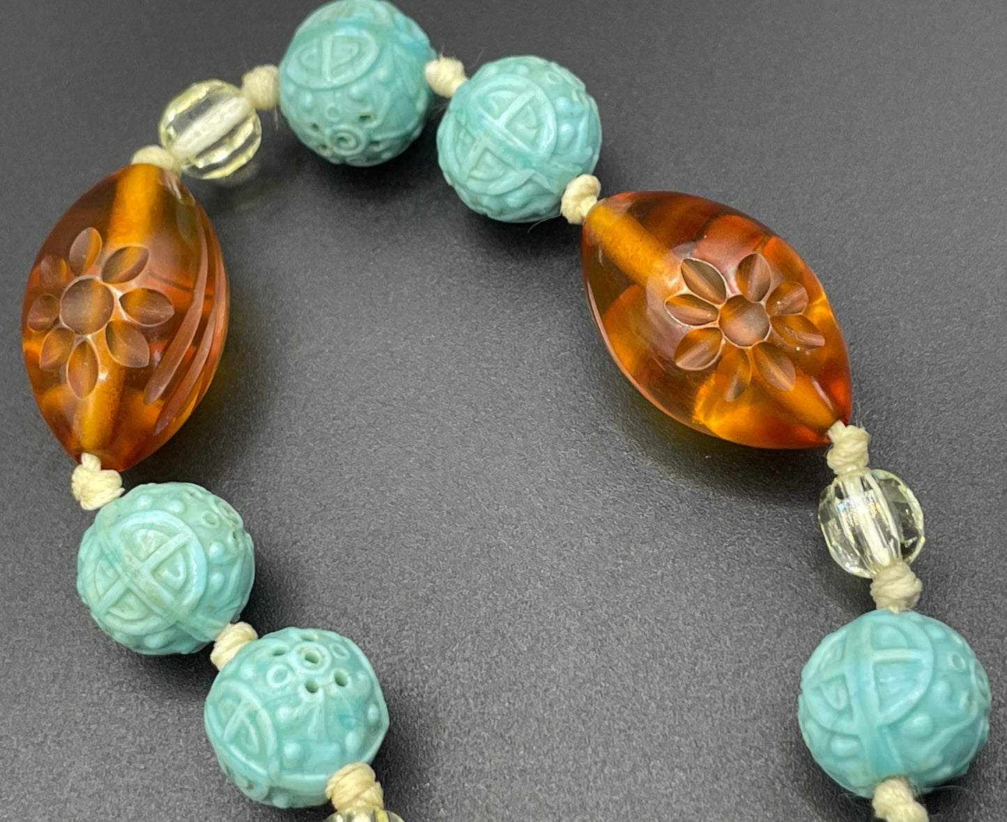 Vintage Art Deco moulded glass and carved cream galalith large bead necklace, pale blue, clear and citrine yellow / orange glass