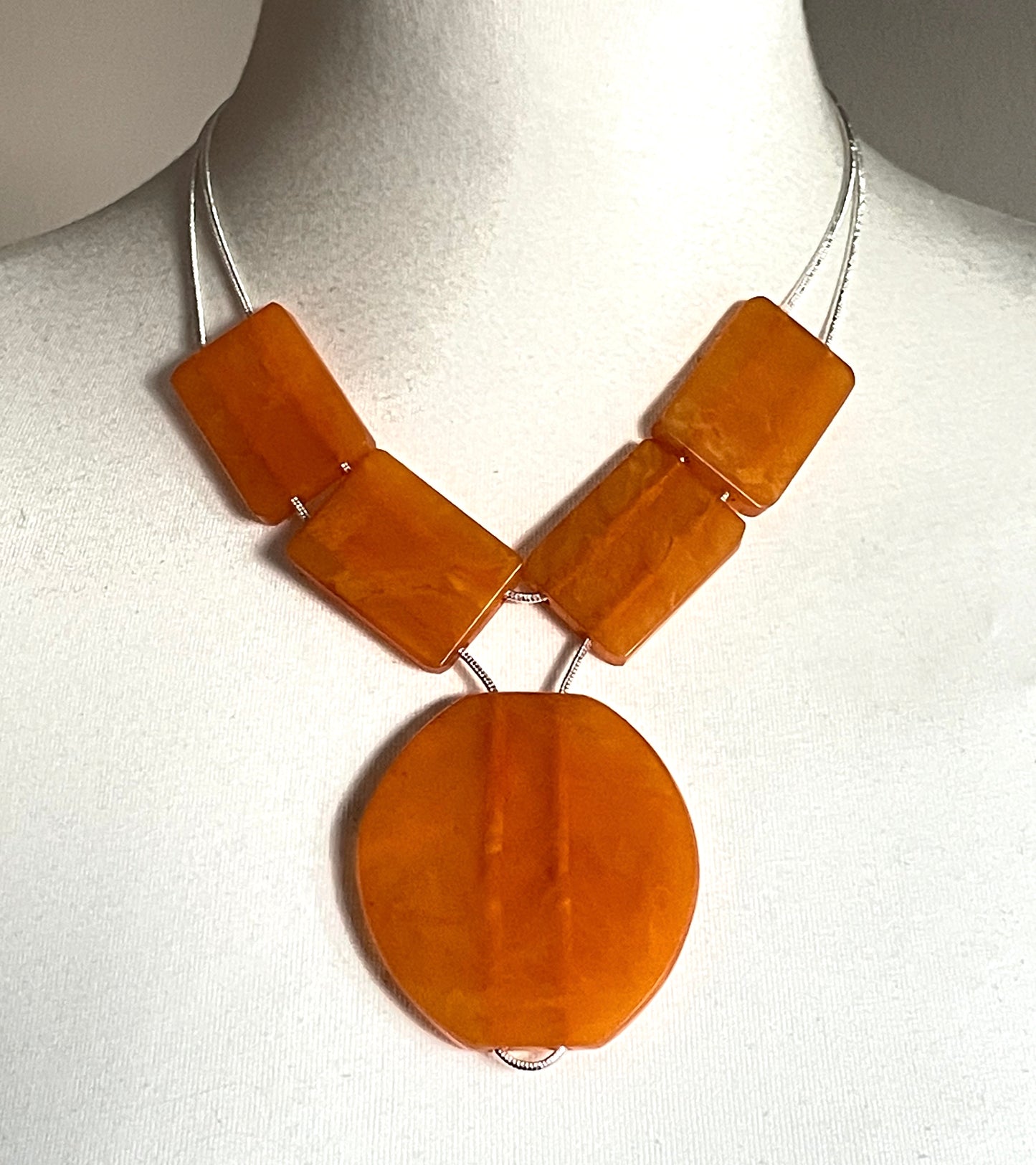 Vintage Art Deco marbled orange galalith huge bead necklace with double strand silver tone chrome machine age snake chains