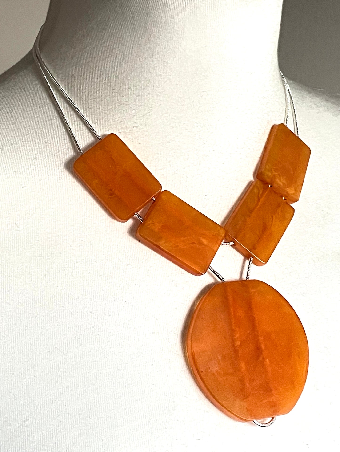 Vintage Art Deco marbled orange galalith huge bead necklace with double strand silver tone chrome machine age snake chains