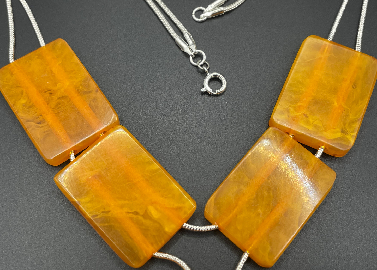 Vintage Art Deco marbled orange galalith huge bead necklace with double strand silver tone chrome machine age snake chains