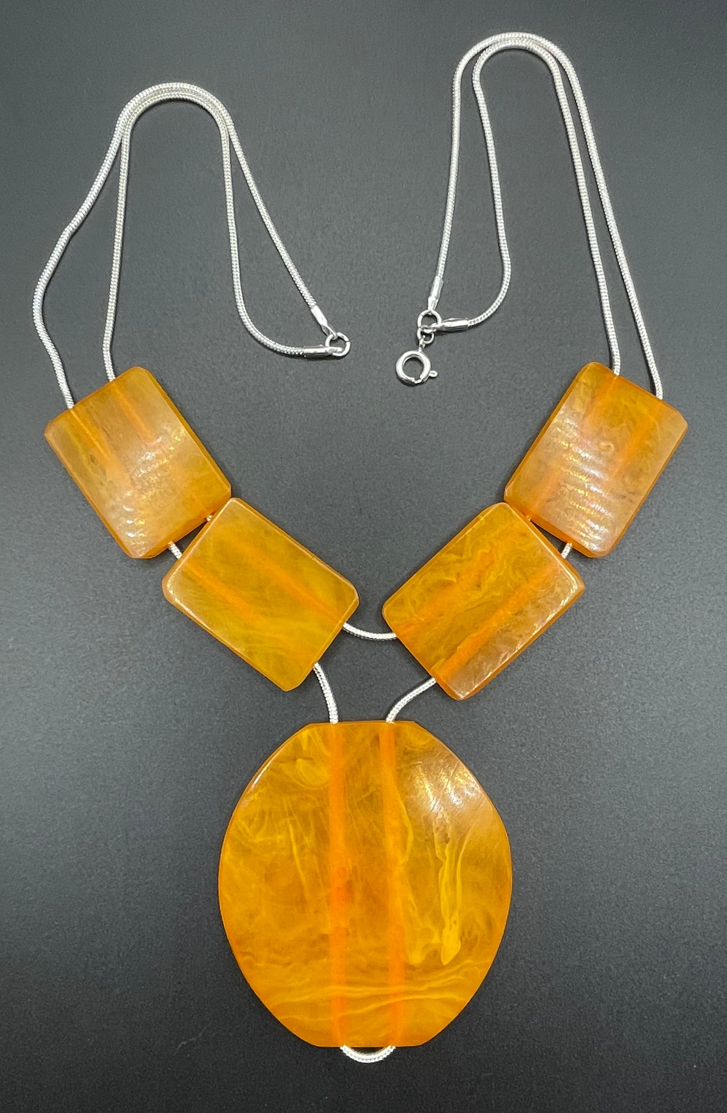 Vintage Art Deco marbled orange galalith huge bead necklace with double strand silver tone chrome machine age snake chains