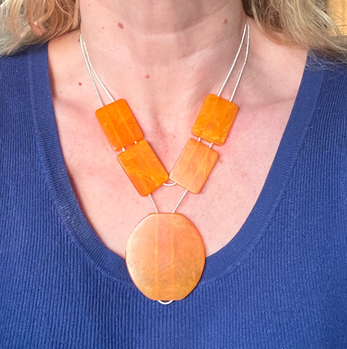 Vintage Art Deco marbled orange galalith huge bead necklace with double strand silver tone chrome machine age snake chains