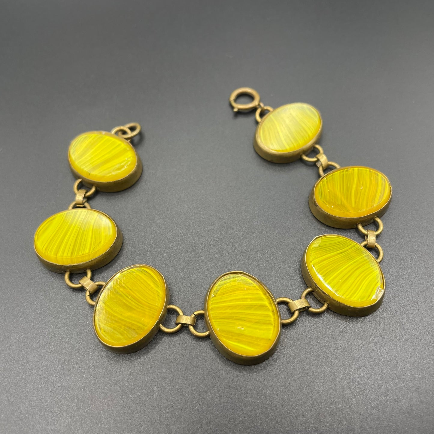 Vintage bright yellow marbled glass riviere collet set bracelet, bezel set, open backed large, oval banded glass stones, such unusual stones