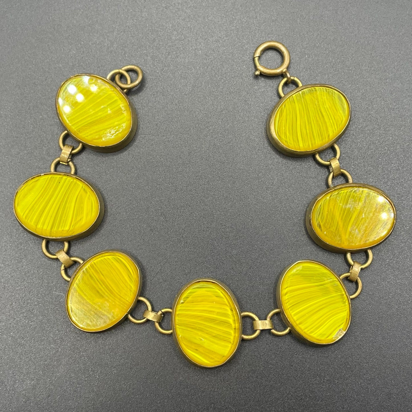 Vintage bright yellow marbled glass riviere collet set bracelet, bezel set, open backed large, oval banded glass stones, such unusual stones