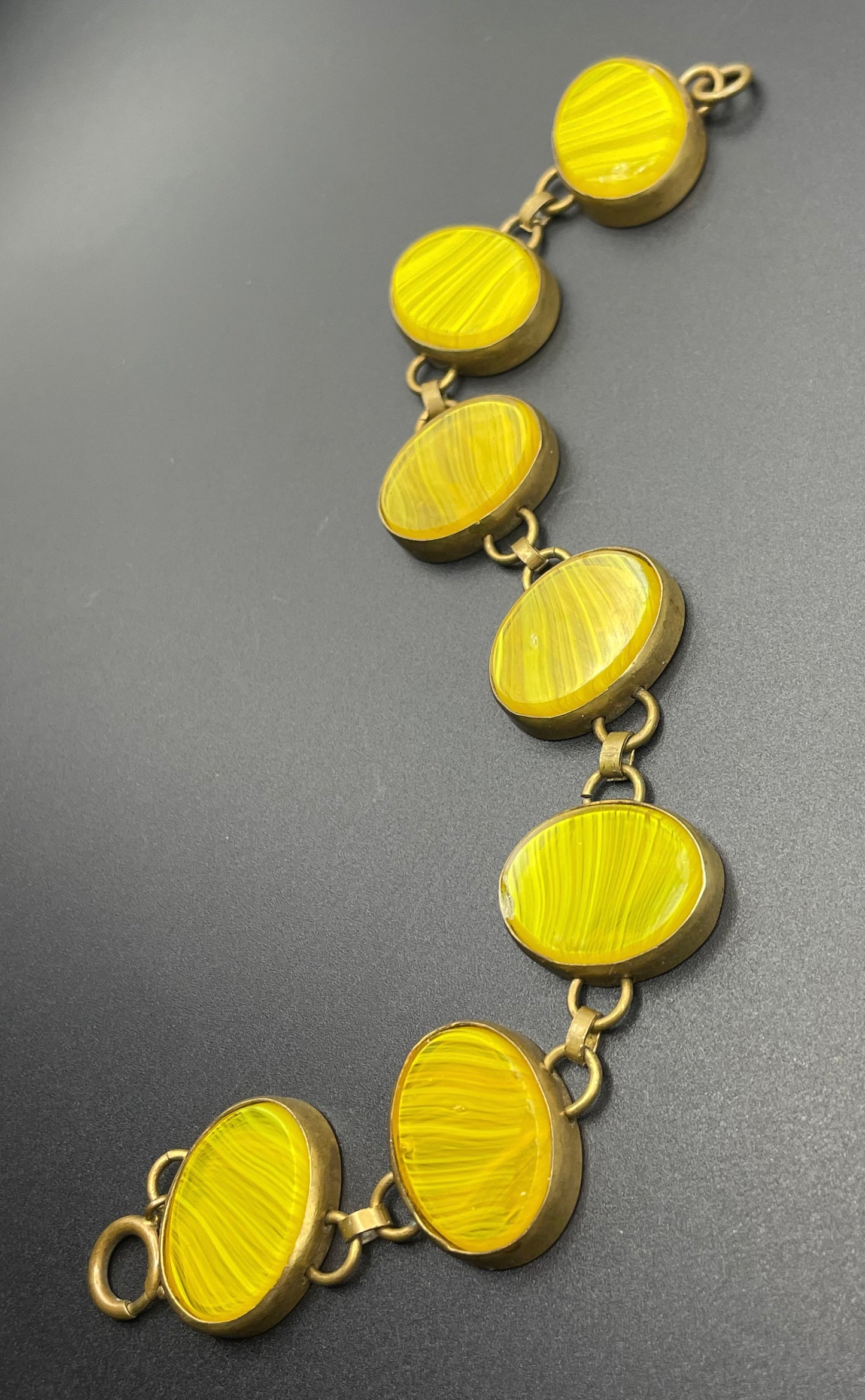 Vintage bright yellow marbled glass riviere collet set bracelet, bezel set, open backed large, oval banded glass stones, such unusual stones