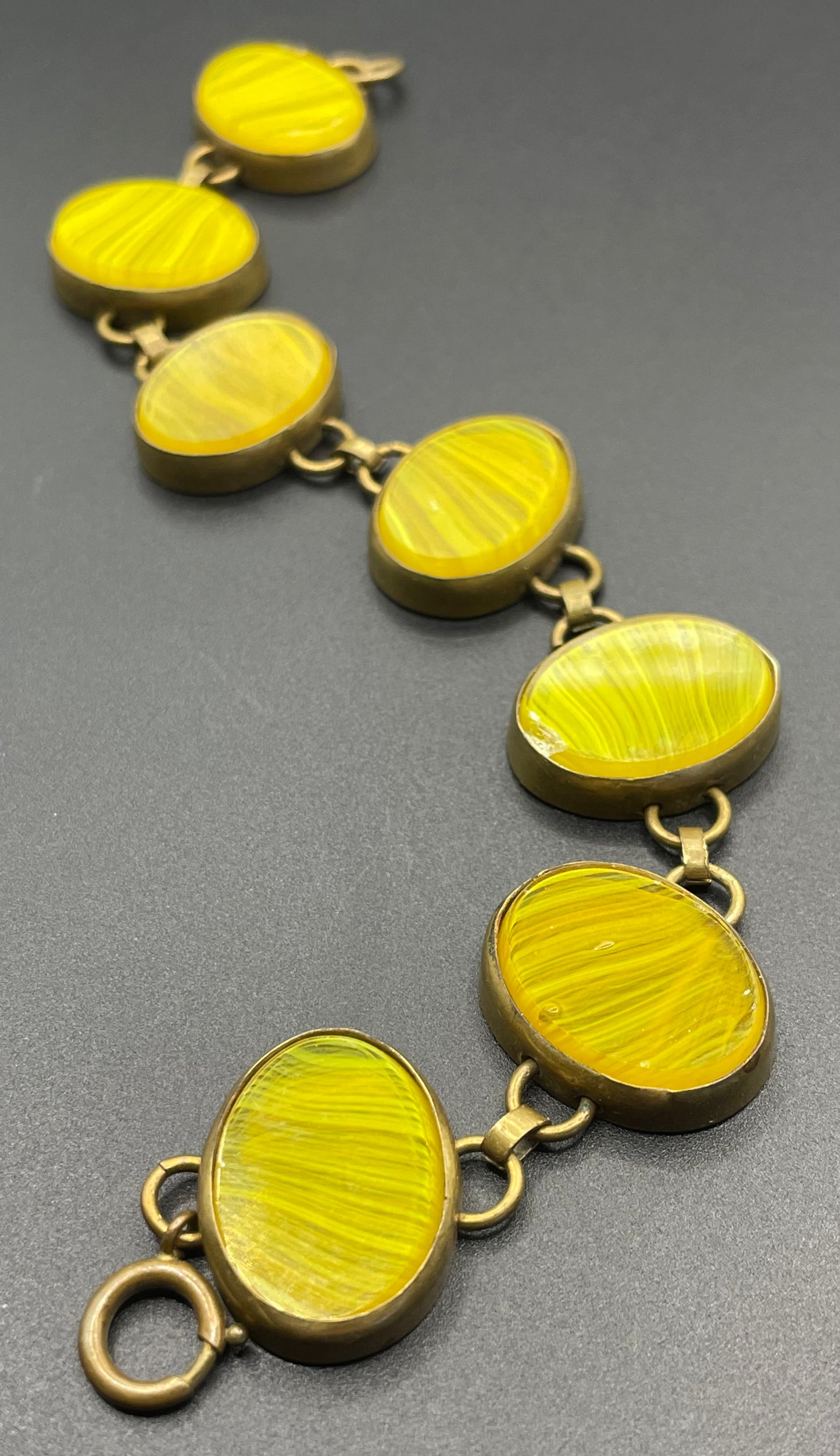 Vintage bright yellow marbled glass riviere collet set bracelet, bezel set, open backed large, oval banded glass stones, such unusual stones