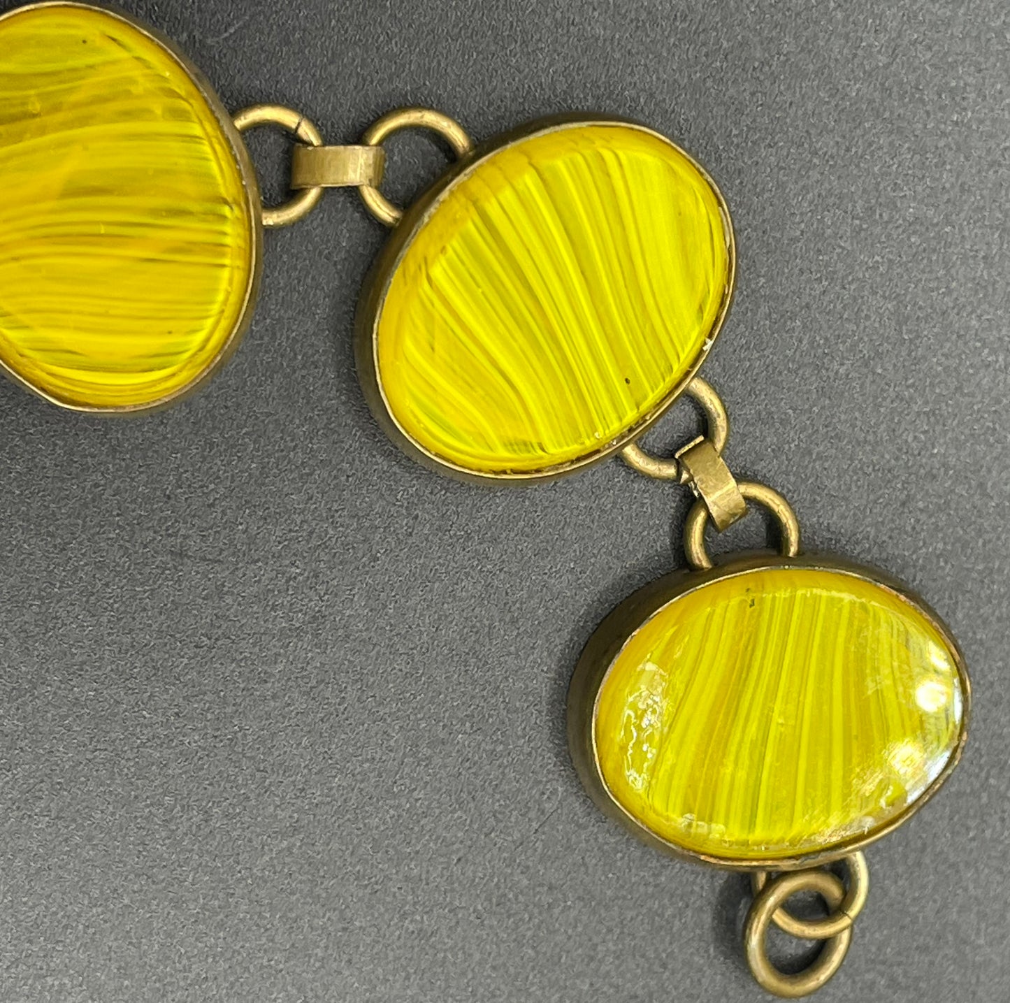 Vintage bright yellow marbled glass riviere collet set bracelet, bezel set, open backed large, oval banded glass stones, such unusual stones