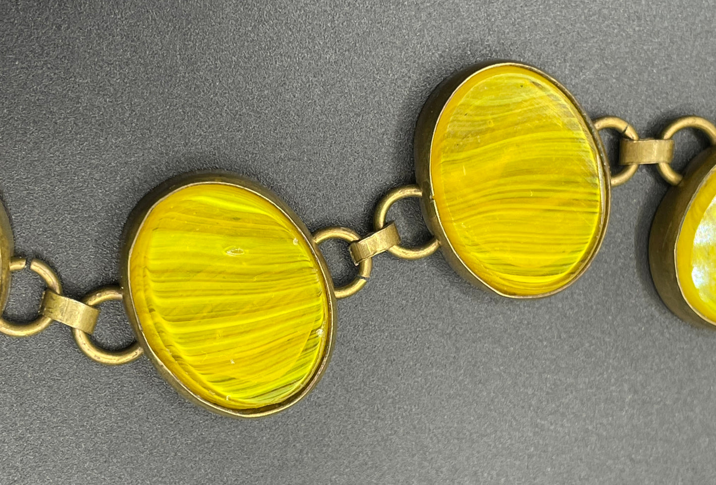 Vintage bright yellow marbled glass riviere collet set bracelet, bezel set, open backed large, oval banded glass stones, such unusual stones