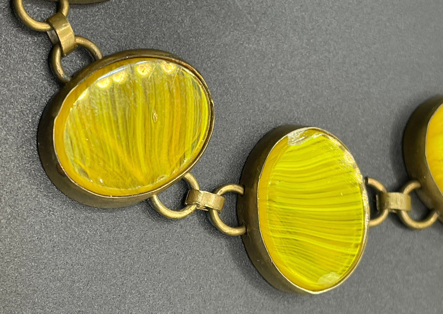 Vintage bright yellow marbled glass riviere collet set bracelet, bezel set, open backed large, oval banded glass stones, such unusual stones