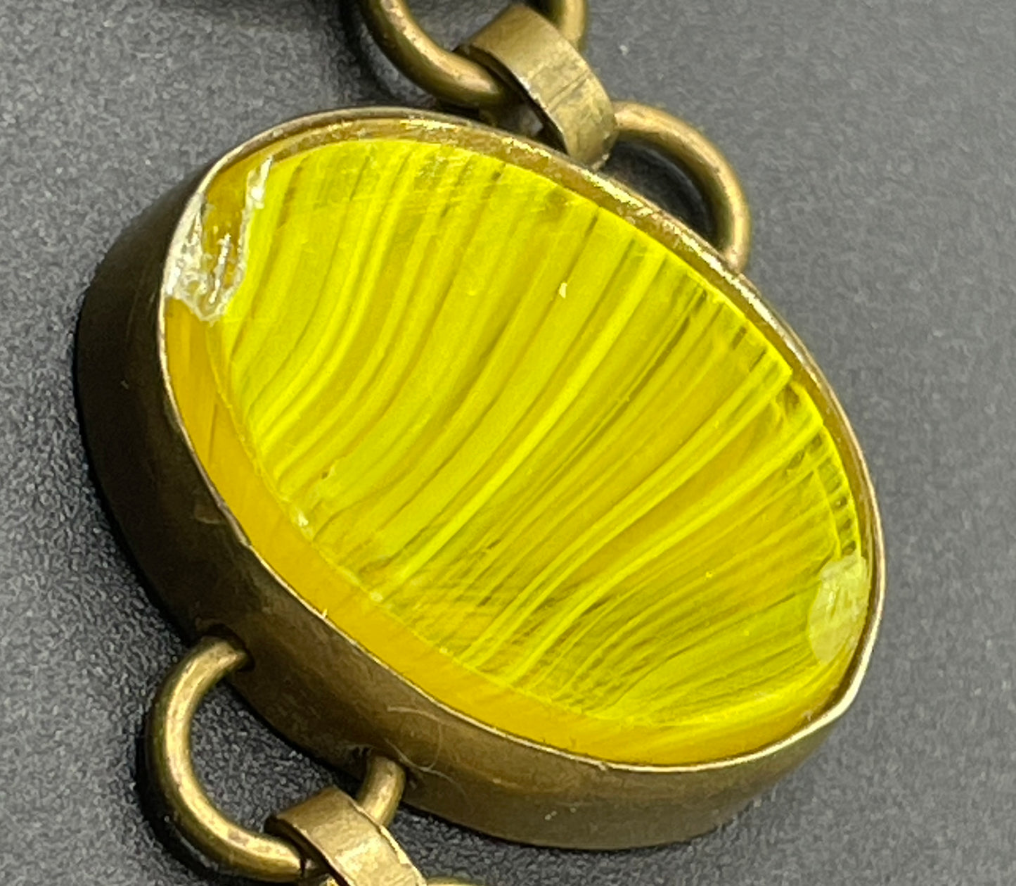 Vintage bright yellow marbled glass riviere collet set bracelet, bezel set, open backed large, oval banded glass stones, such unusual stones