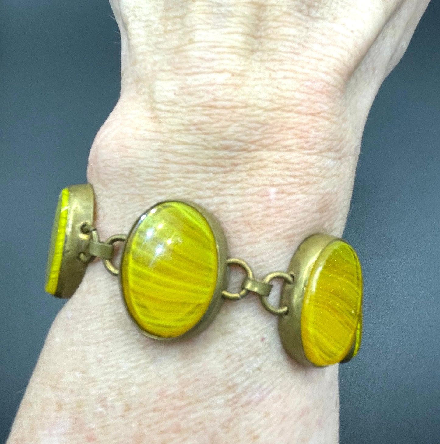 Vintage bright yellow marbled glass riviere collet set bracelet, bezel set, open backed large, oval banded glass stones, such unusual stones
