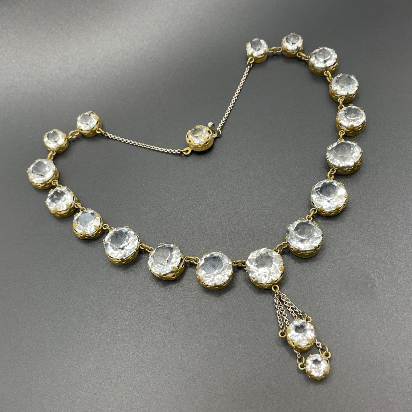 Antique paste riviere necklace, open backed gold tone brass settings, beautiful clear paste rhinestones, negligee pendant tassels