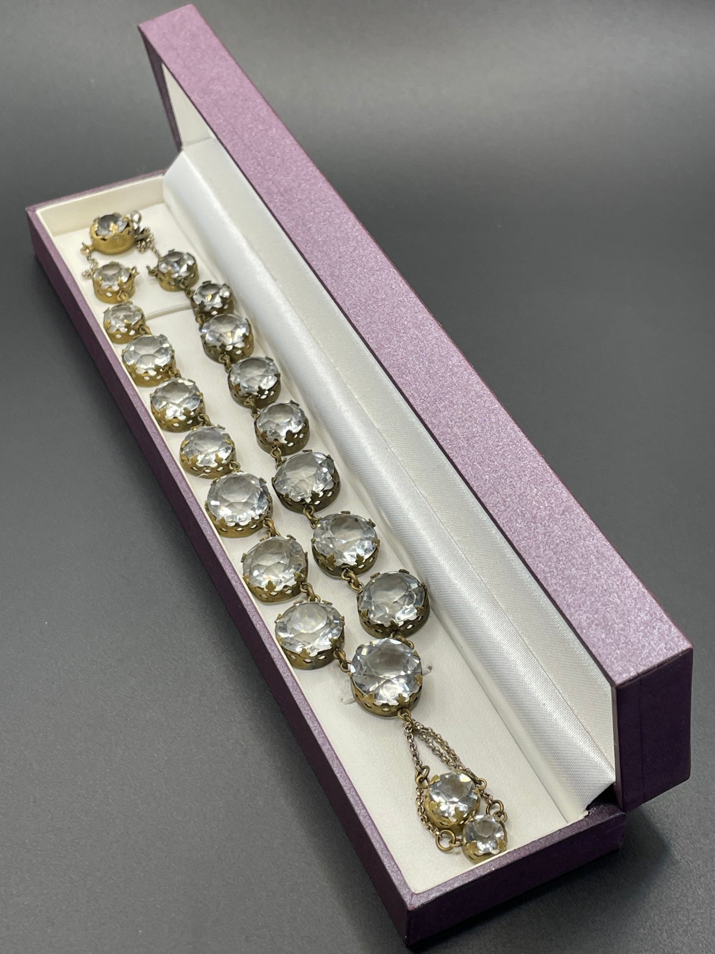 Antique paste riviere necklace, open backed gold tone brass settings, beautiful clear paste rhinestones, negligee pendant tassels