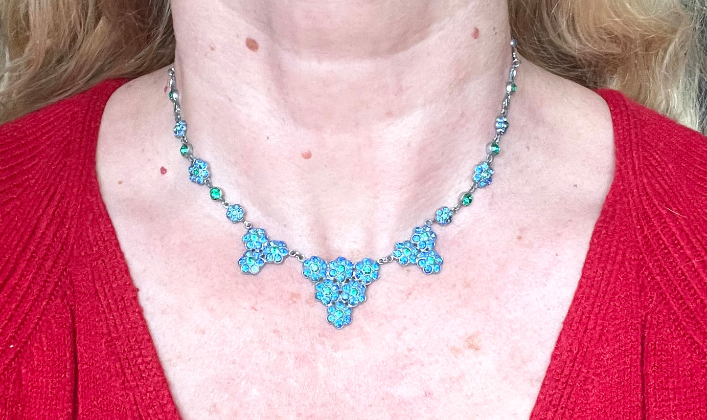 Vintage bright blue and green paste rhinestone and shiny silver tone necklace, 1930s to 1940s machine age links, floral design