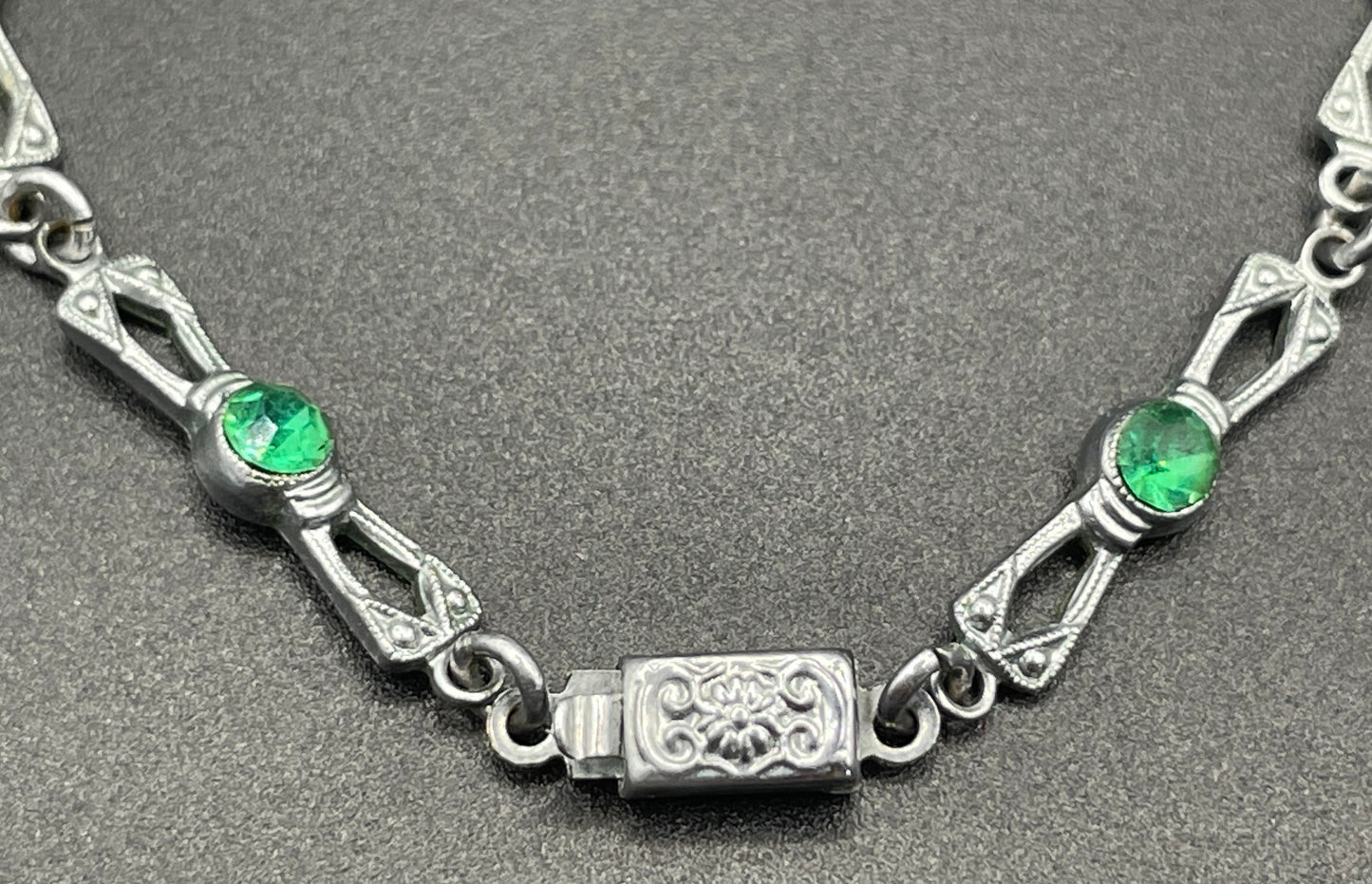 Vintage bright blue and green paste rhinestone and shiny silver tone necklace, 1930s to 1940s machine age links, floral design