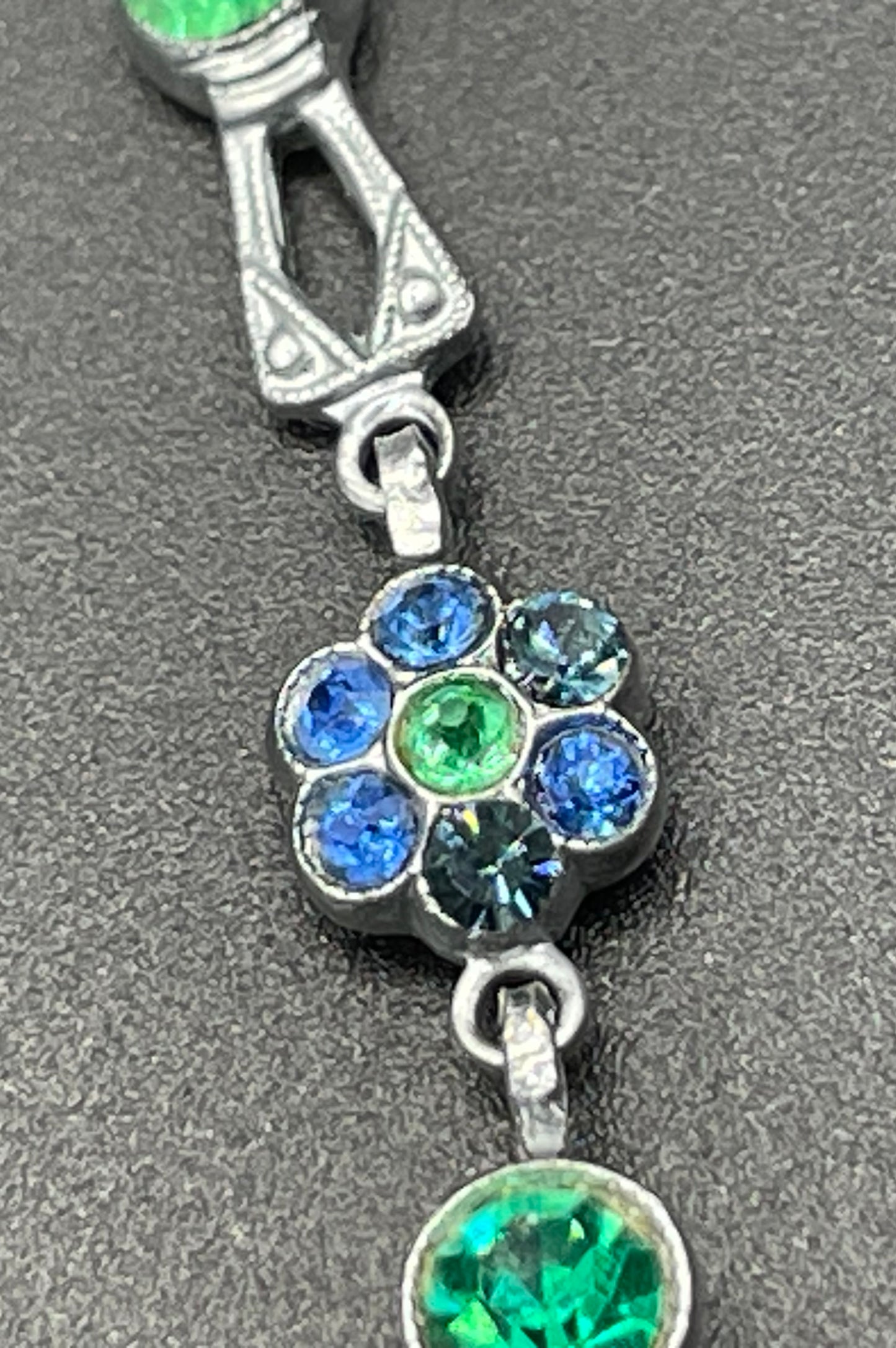 Vintage bright blue and green paste rhinestone and shiny silver tone necklace, 1930s to 1940s machine age links, floral design