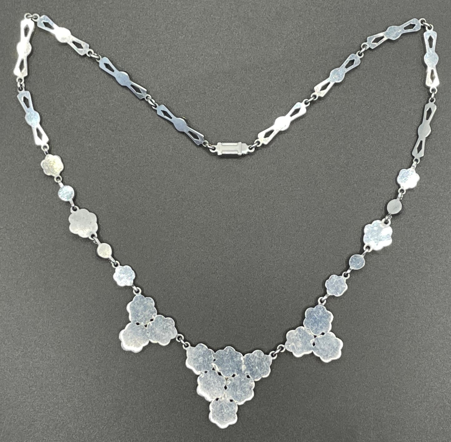 Vintage bright blue and green paste rhinestone and shiny silver tone necklace, 1930s to 1940s machine age links, floral design