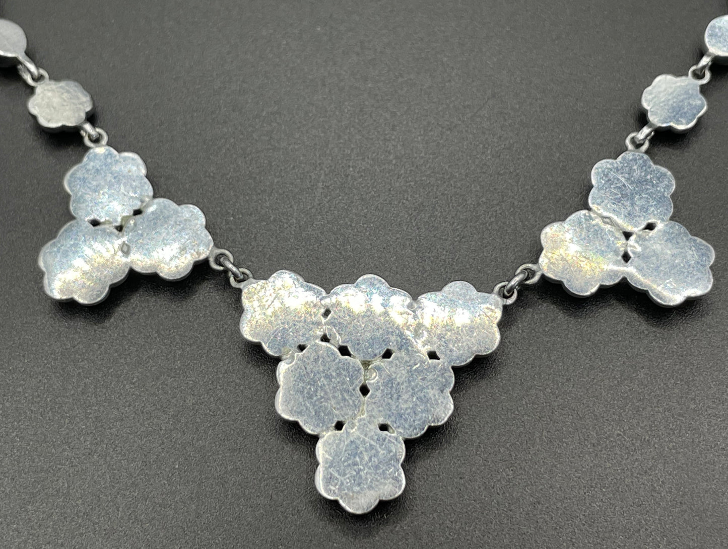 Vintage bright blue and green paste rhinestone and shiny silver tone necklace, 1930s to 1940s machine age links, floral design