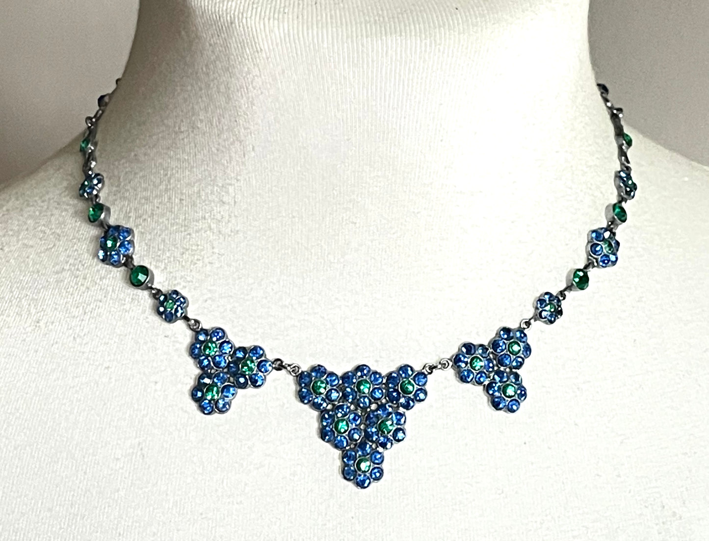 Vintage bright blue and green paste rhinestone and shiny silver tone necklace, 1930s to 1940s machine age links, floral design