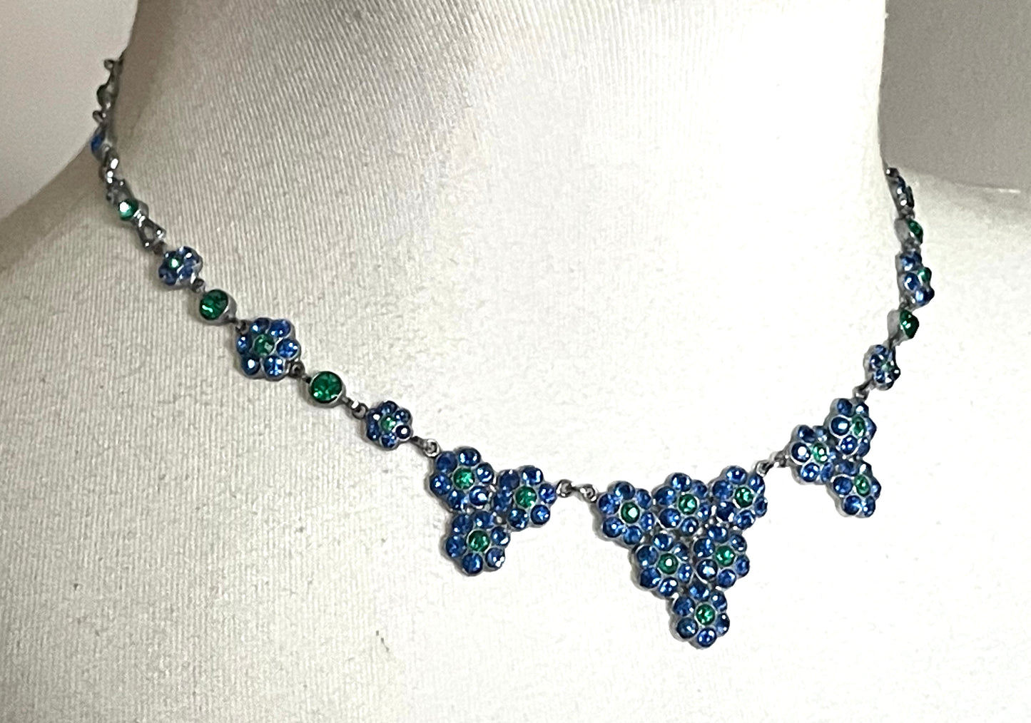 Vintage bright blue and green paste rhinestone and shiny silver tone necklace, 1930s to 1940s machine age links, floral design