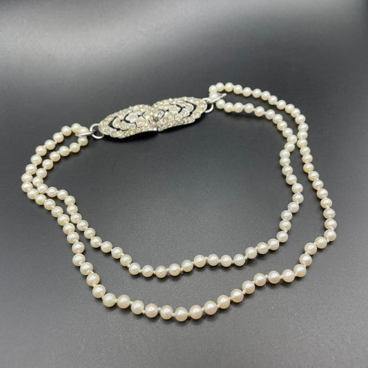 Vintage real cultured pearl necklace, longer length so can be worn as a double strand with the included vintage rhinestone necklace clip