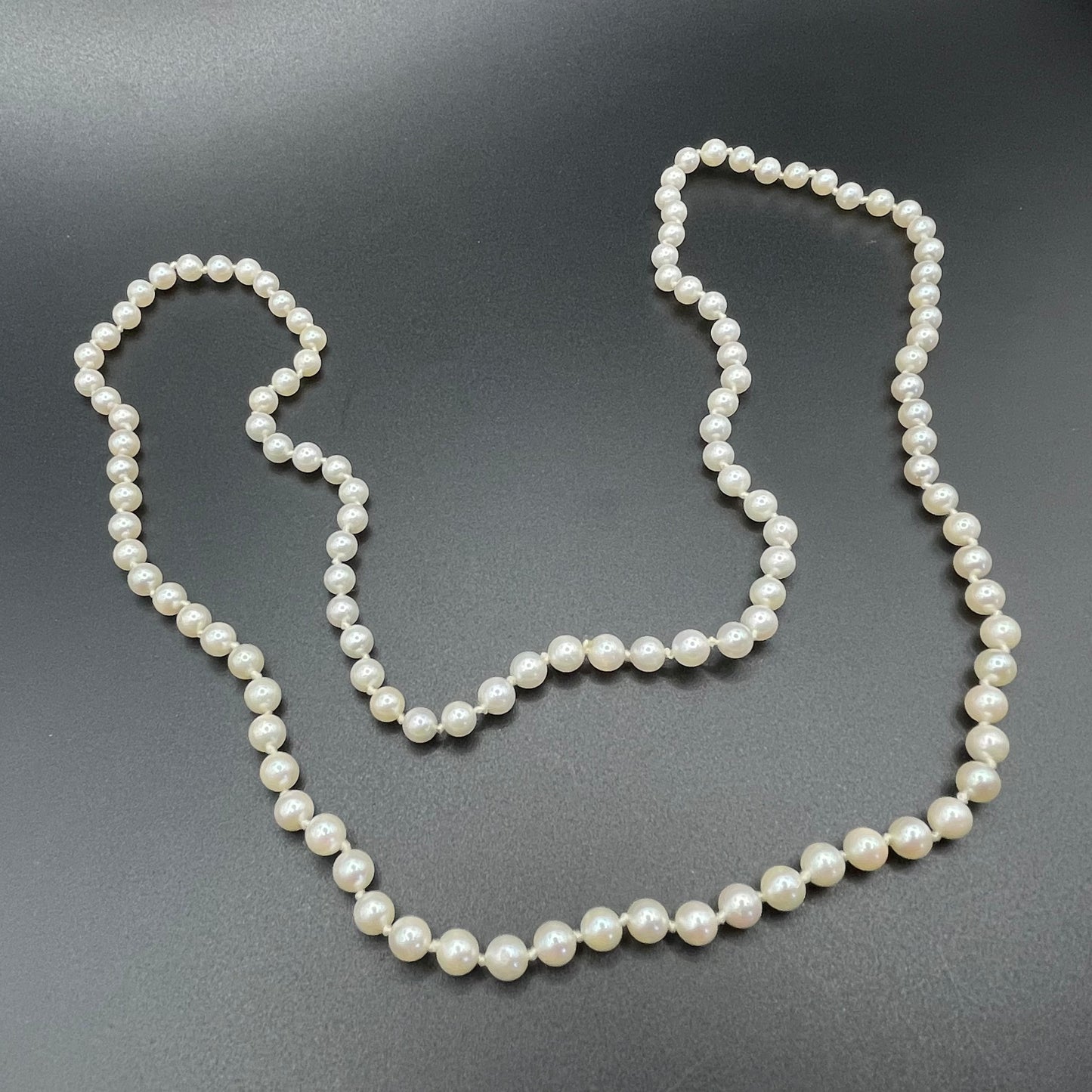 Vintage real cultured pearl necklace, longer length so can be worn as a double strand with the included vintage rhinestone necklace clip