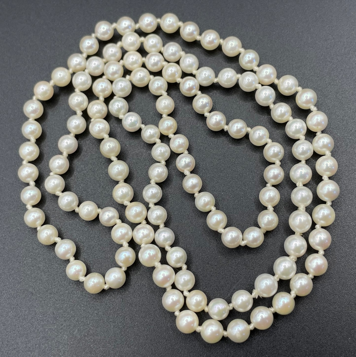 Vintage real cultured pearl necklace, longer length so can be worn as a double strand with the included vintage rhinestone necklace clip