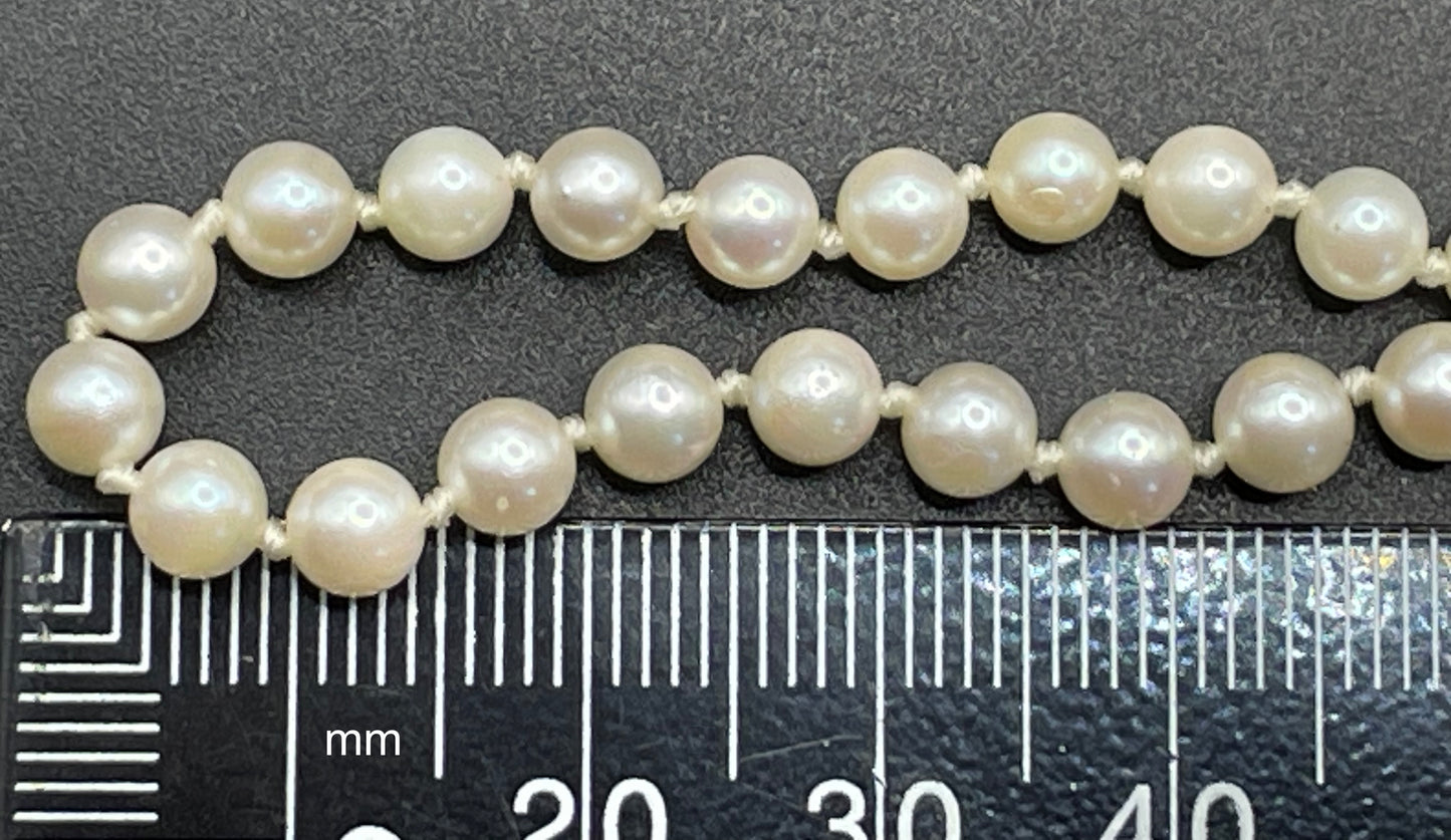 Vintage real cultured pearl necklace, longer length so can be worn as a double strand with the included vintage rhinestone necklace clip