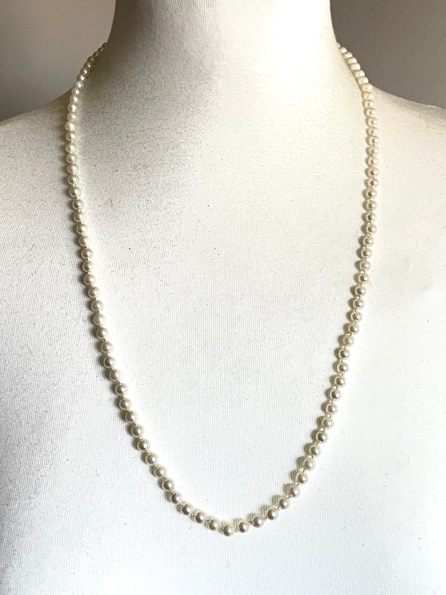 Vintage real cultured pearl necklace, longer length so can be worn as a double strand with the included vintage rhinestone necklace clip