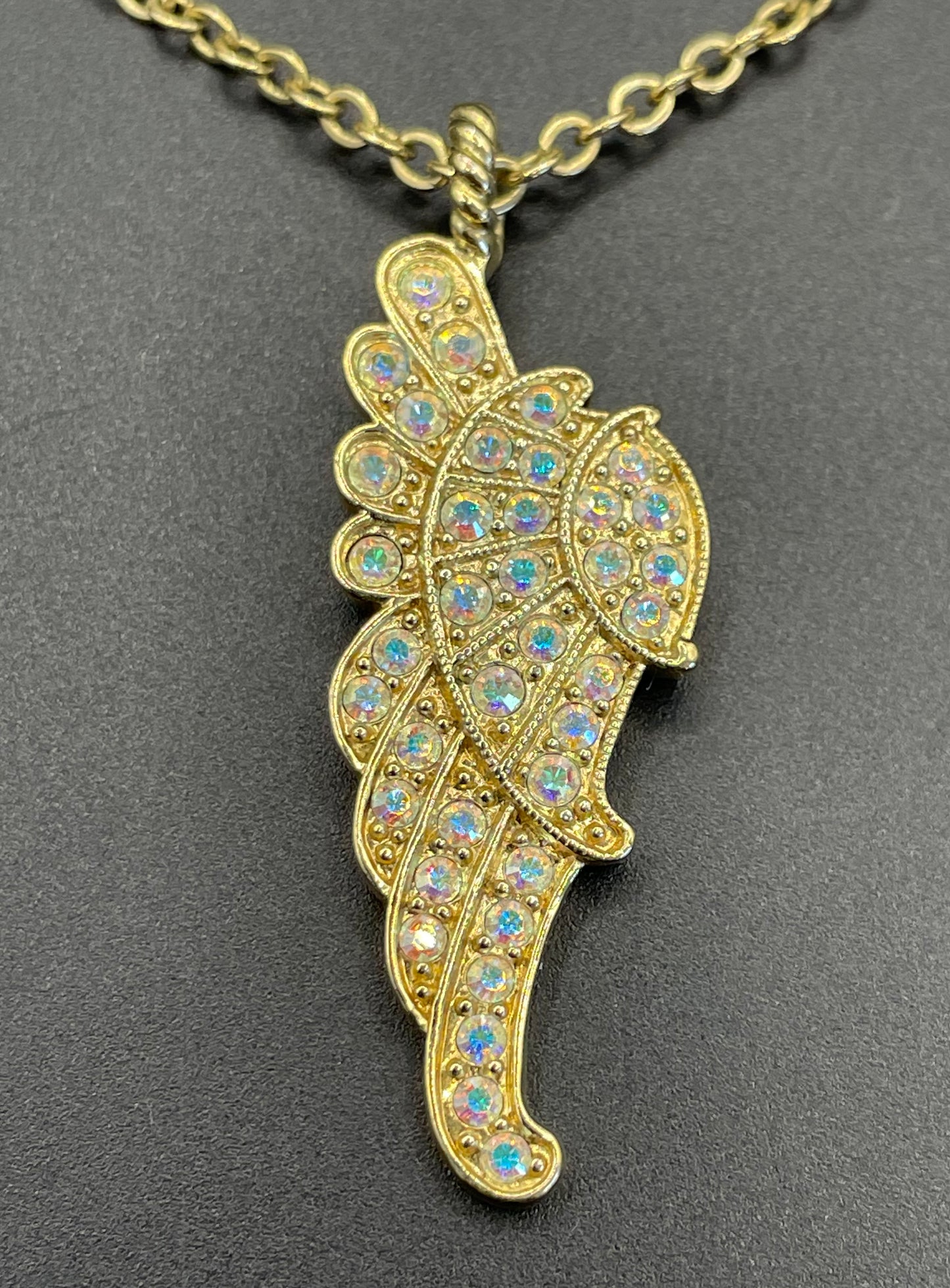Vintage signed Kirk's Folly angel wing motif pendant necklace and clamper bangle set, in gold tone with aurora borealis AB rhinestones