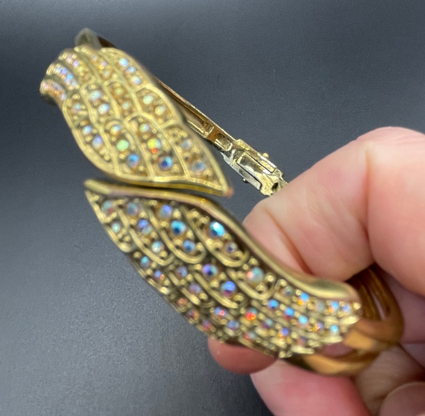 Vintage signed Kirk's Folly angel wing motif pendant necklace and clamper bangle set, in gold tone with aurora borealis AB rhinestones