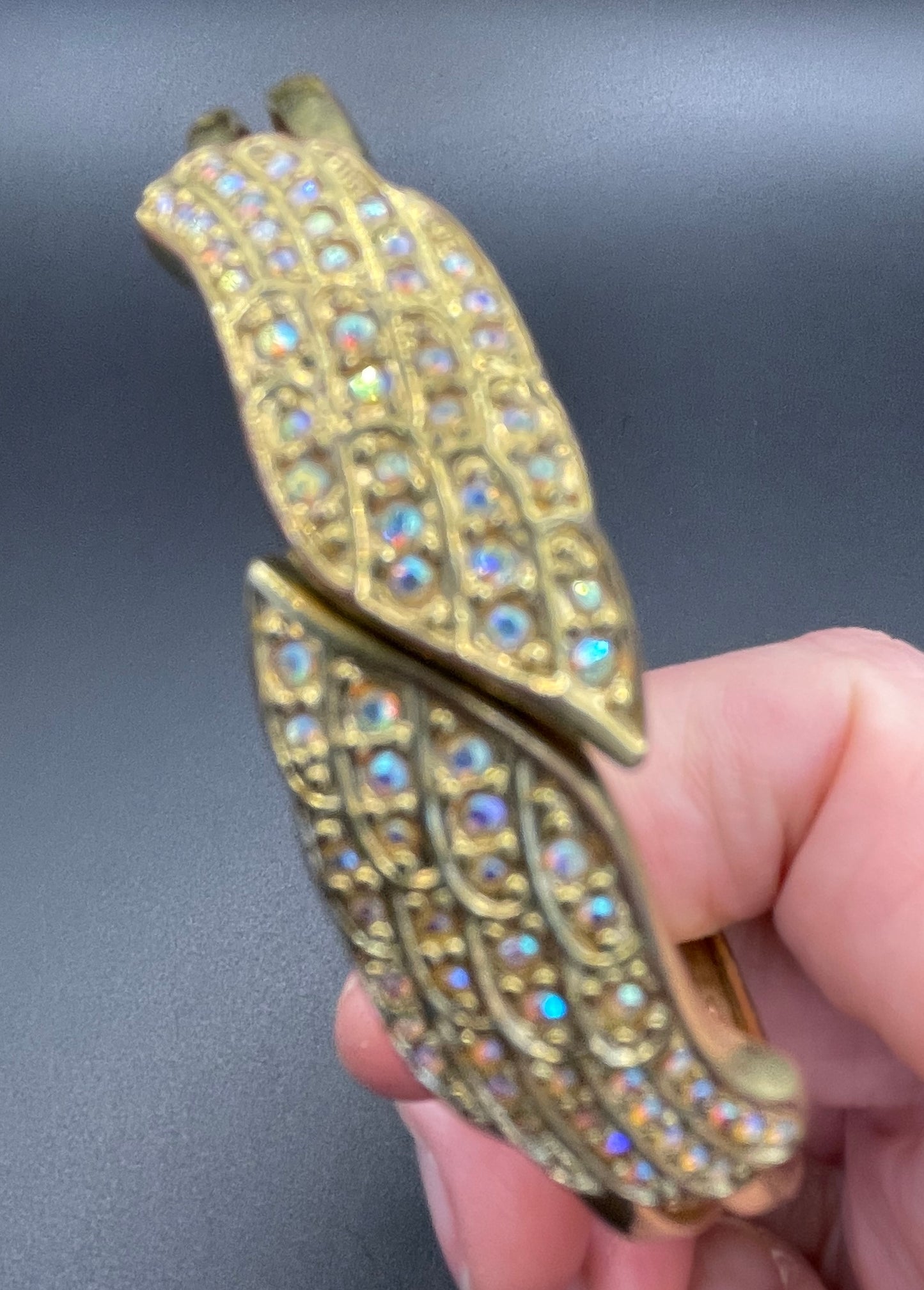 Vintage signed Kirk's Folly angel wing motif pendant necklace and clamper bangle set, in gold tone with aurora borealis AB rhinestones