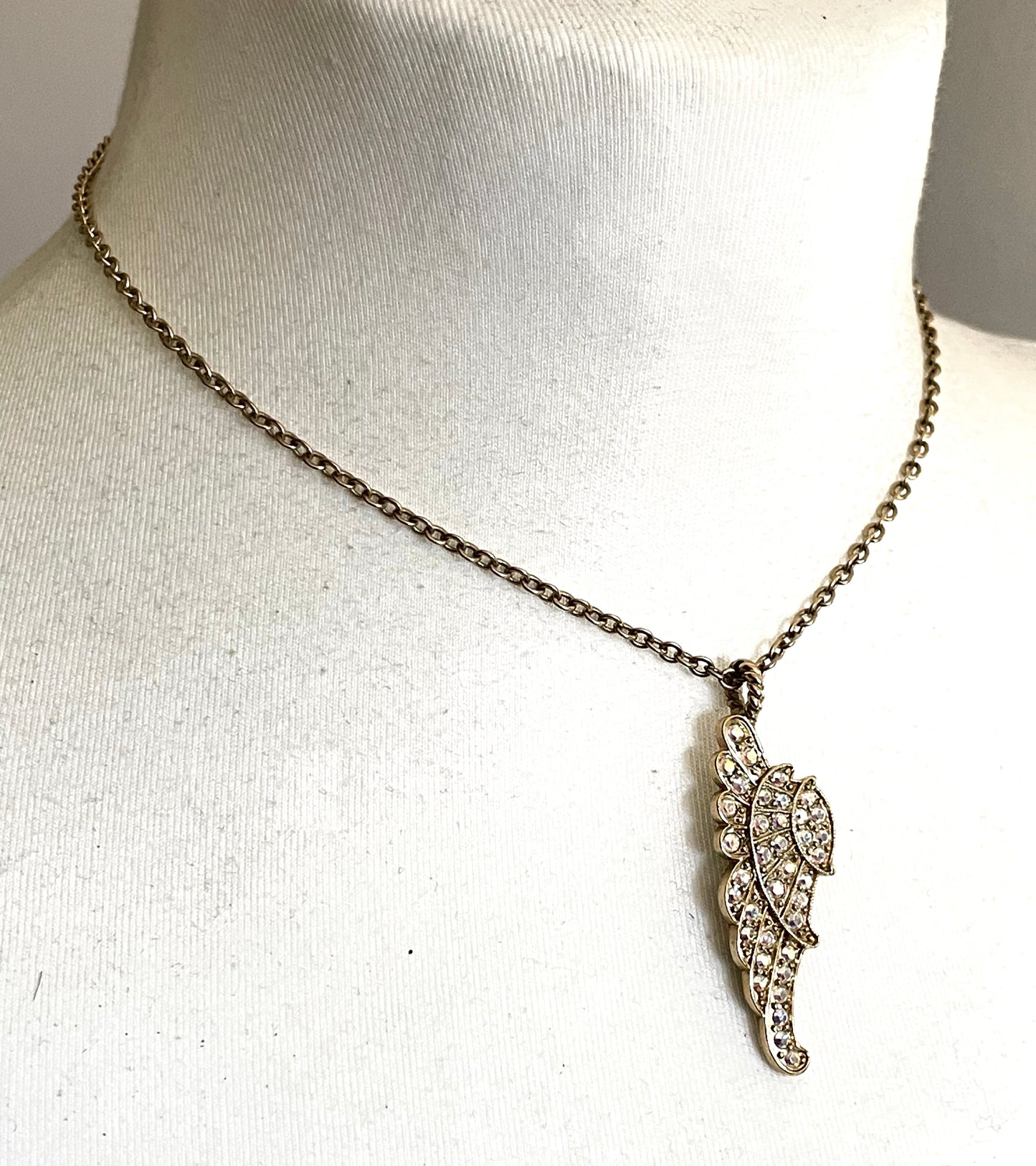 Vintage signed Kirk's Folly angel wing motif pendant necklace and clamper bangle set, in gold tone with aurora borealis AB rhinestones