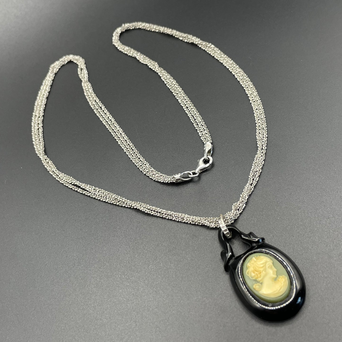Antique Victorian carved Whitby jet cameo pendant here with a more modern multi-strand 20-inch Italian sterling silver popcorn chain