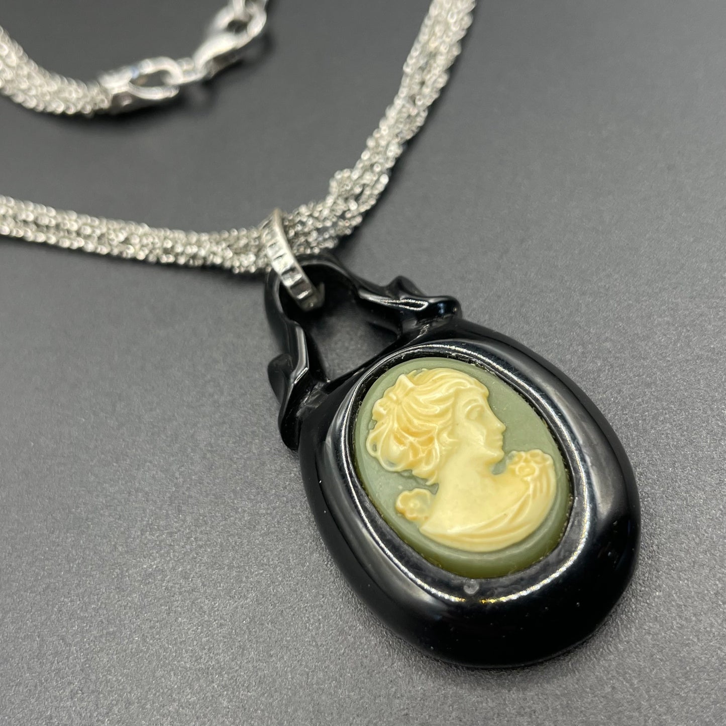 Antique Victorian carved Whitby jet cameo pendant here with a more modern multi-strand 20-inch Italian sterling silver popcorn chain