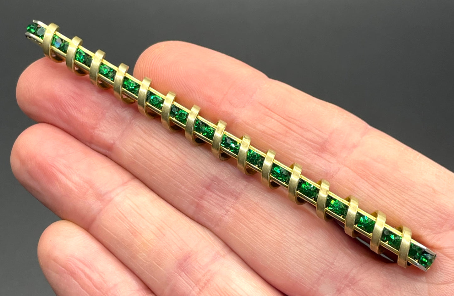 Vintage Schreiber & Hiller Art Deco channel set paste emerald green rhinestone  and gold tone machine age long bar brooch