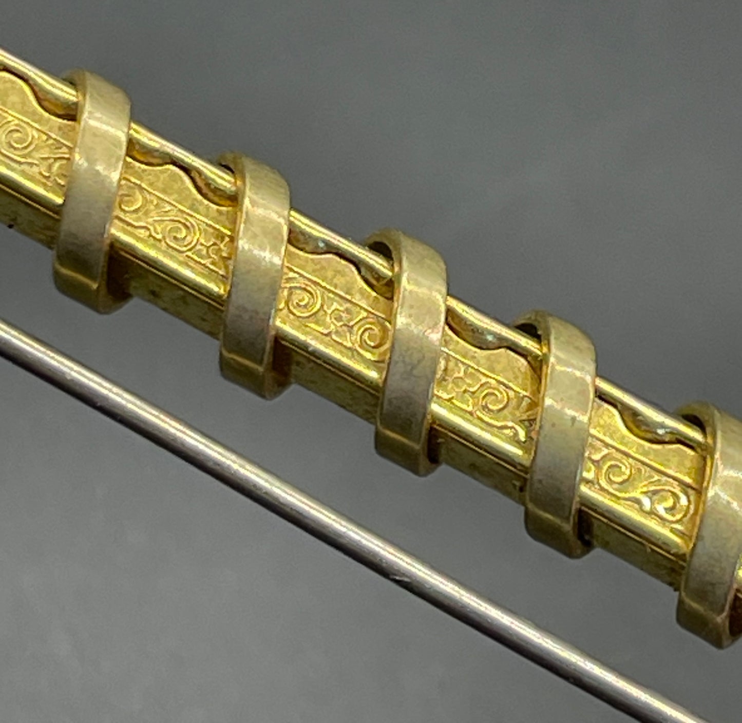 Vintage Schreiber & Hiller Art Deco channel set paste emerald green rhinestone  and gold tone machine age long bar brooch