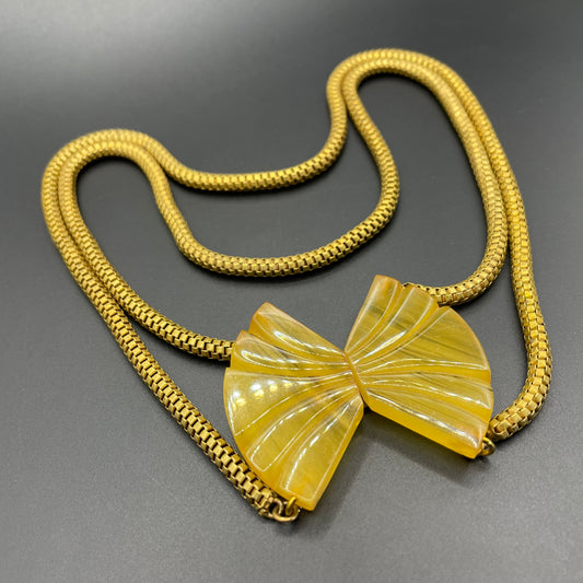 Vintage Art Deco marbled yellow galalith buckle necklace with double strand antique gold tone machine age snake chains, front fastening