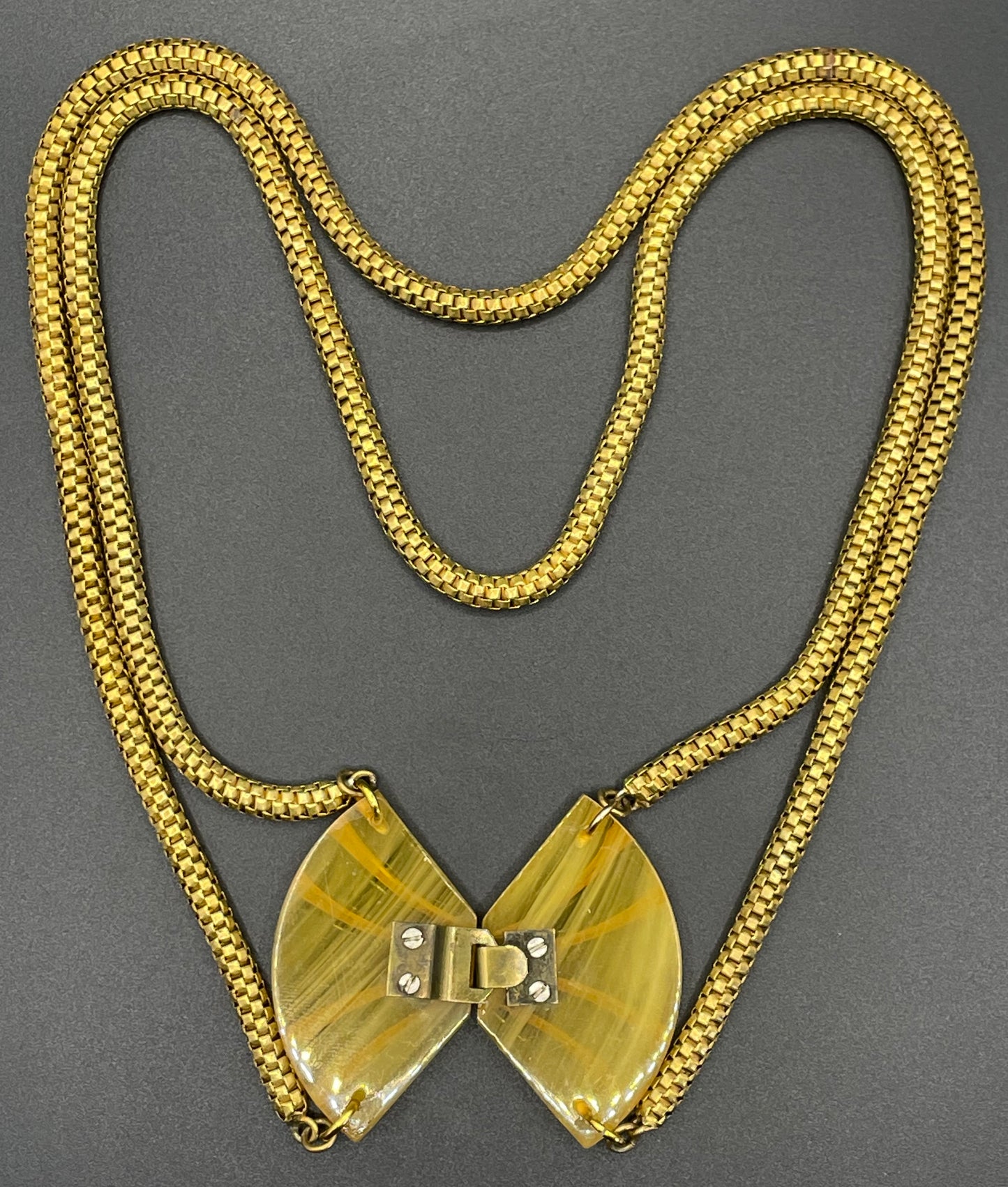 Vintage Art Deco marbled yellow galalith buckle necklace with double strand antique gold tone machine age snake chains, front fastening