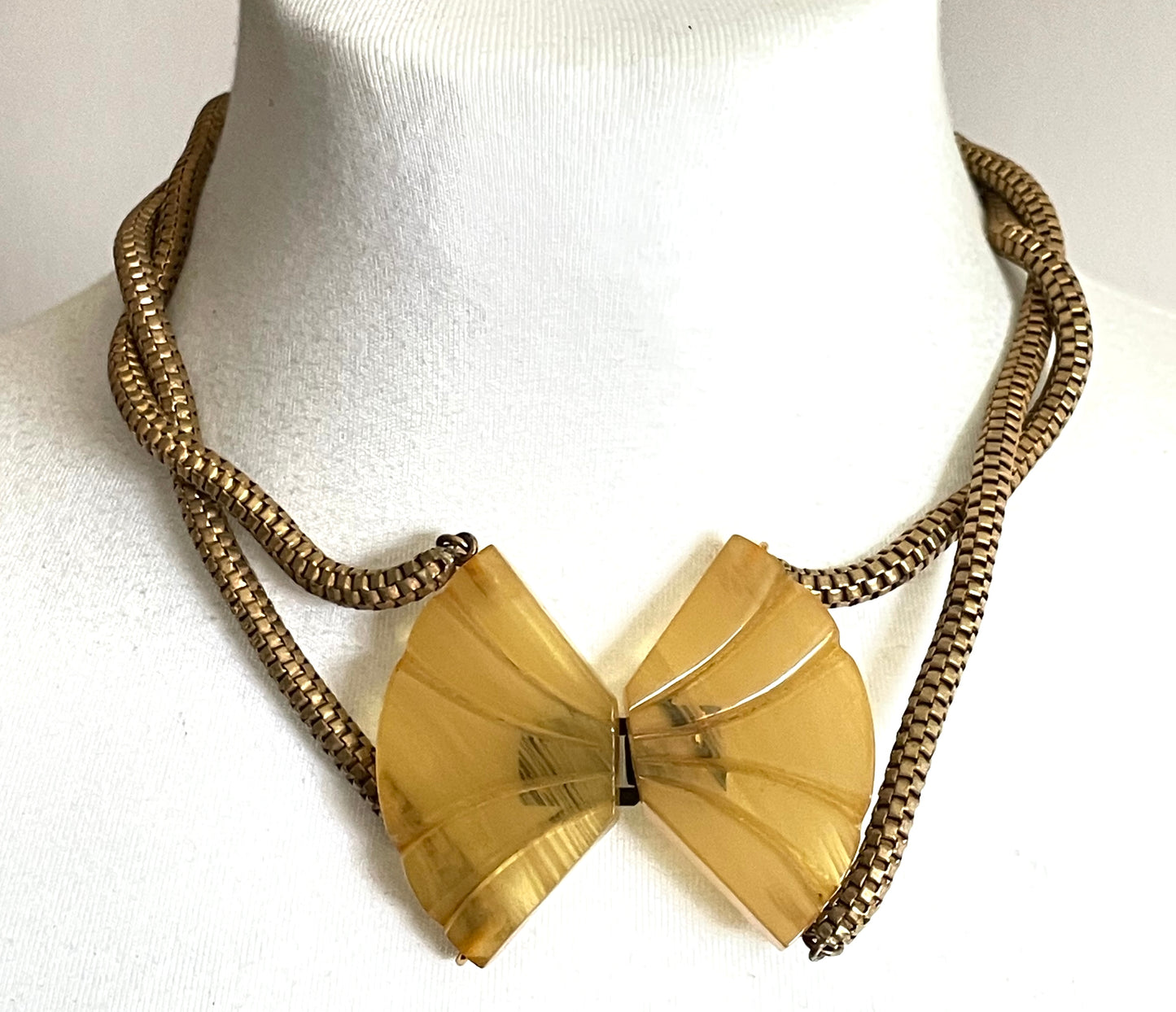 Vintage Art Deco marbled yellow galalith buckle necklace with double strand antique gold tone machine age snake chains, front fastening