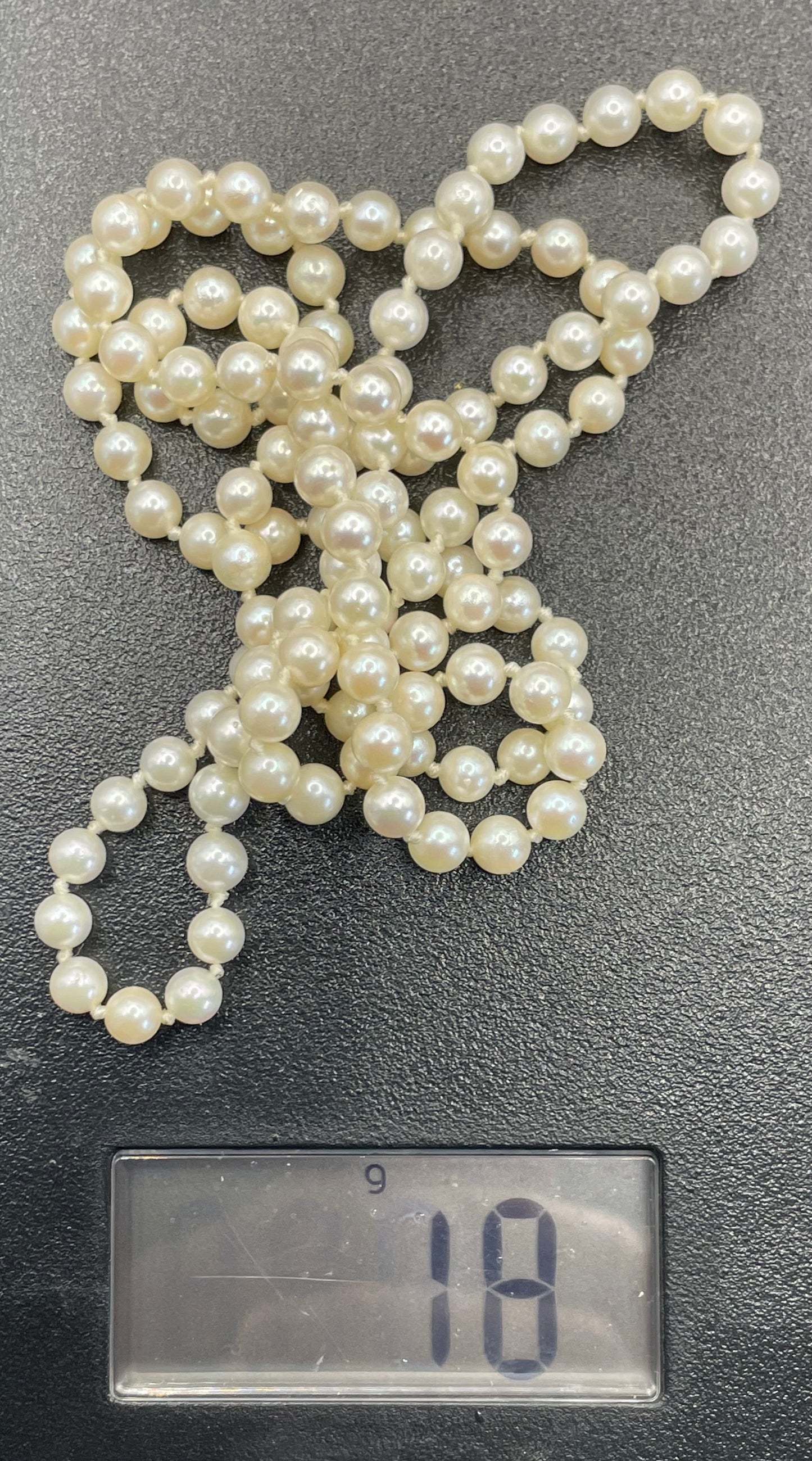 Vintage real cultured pearl necklace, longer length so can be worn as a double strand with the included vintage rhinestone necklace clip